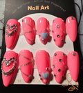 Elegant Pink press on nails accented with rhinestones and hearts